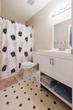 Full bath with vanity and curtained shower