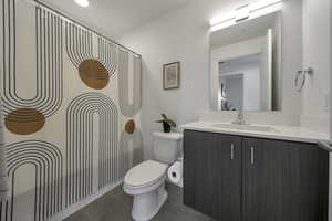 Full bathroom with vanity and a shower
