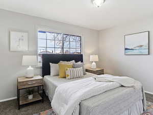 Bedroom with baseboards and carpet floors