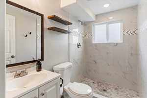 Bathroom with vanity and a stall shower