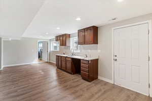 Kitchen featuring light countertops, light wood finished floors, and recessed lighting