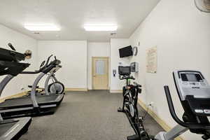 Exercise area with a textured ceiling