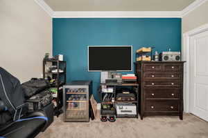 Office featuring ornamental molding and light colored carpet