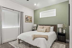 Bedroom featuring dark colored carpet, a ceiling fan, and recessed lighting