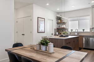 Dining space featuring light wood finished floors and recessed lighting