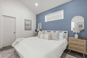 Bedroom with carpet flooring, lofted ceiling, and recessed lighting