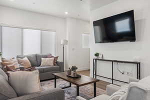 Living room featuring wood finished floors and recessed lighting