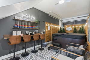 Bar featuring a hot tub