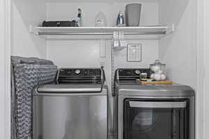 Laundry area with washer and clothes dryer