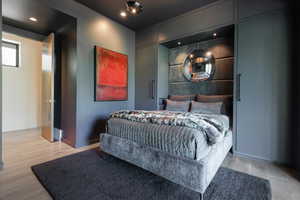 Bedroom featuring light wood finished floors and recessed lighting