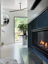 Entrance foyer featuring a fireplace and light wood-style flooring