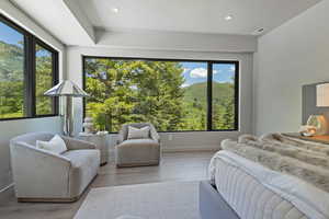 Bedroom featuring wood finished floors, recessed lighting, and a mountain view