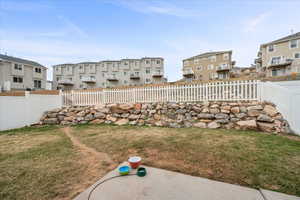 Fenced backyard with a residential view