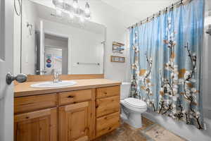 Bathroom featuring vanity, shower / bath combo
