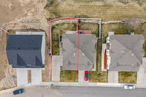 Aerial view of residential area with property boundaries highlighted