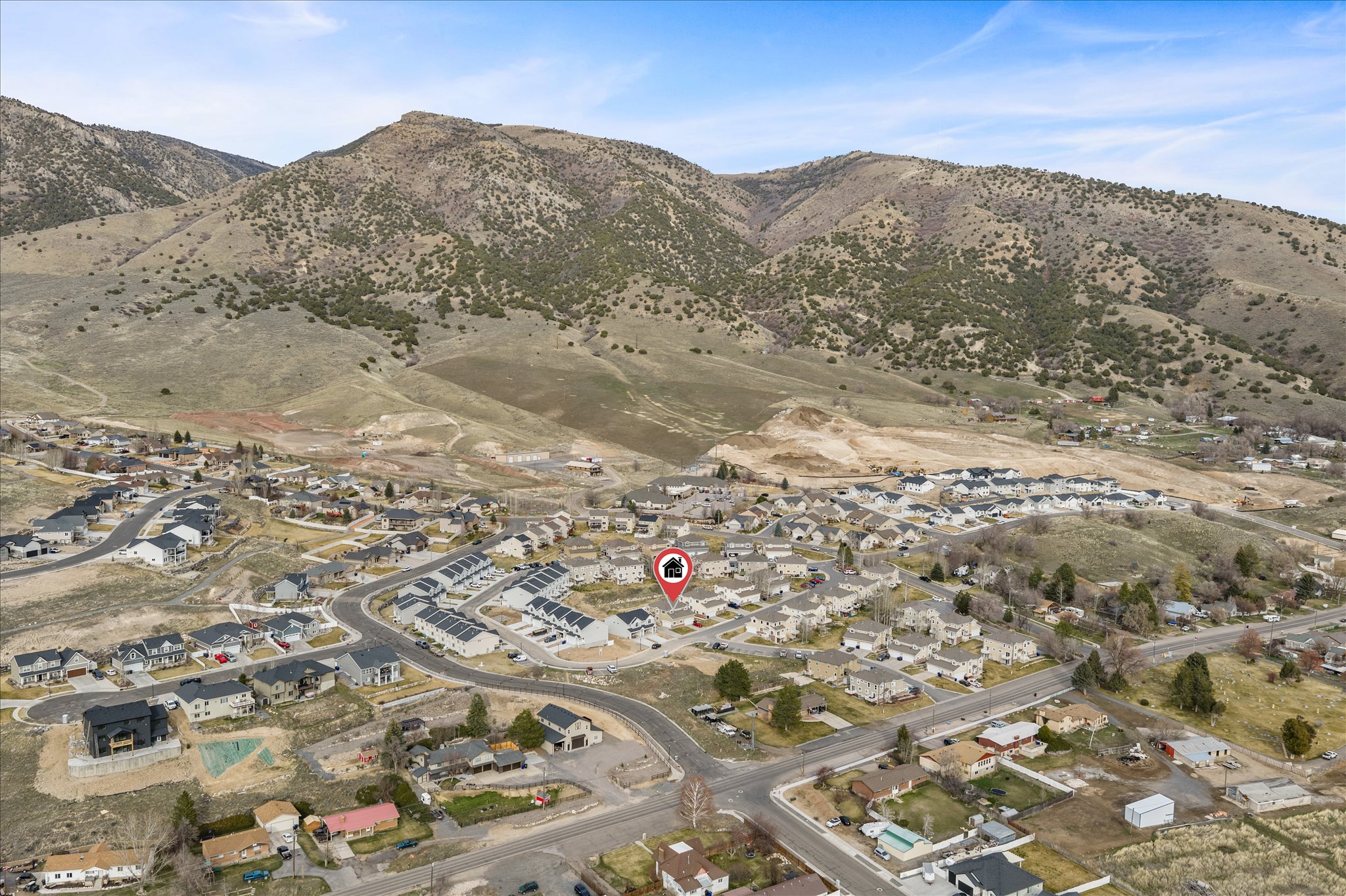 Aerial perspective of area with a mountain backdrop
