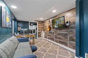 Office featuring wood walls, recessed lighting, and carpet