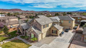 Aerial view of residential area featuring a mountainous background