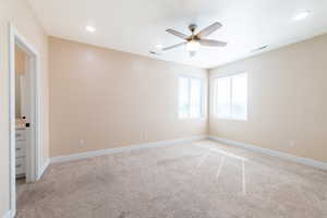 Unfurnished room with light carpet, ceiling fan, and recessed lighting