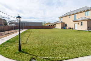 View of fenced backyard