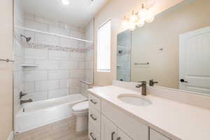 Full bath with vanity and shower / bath combination