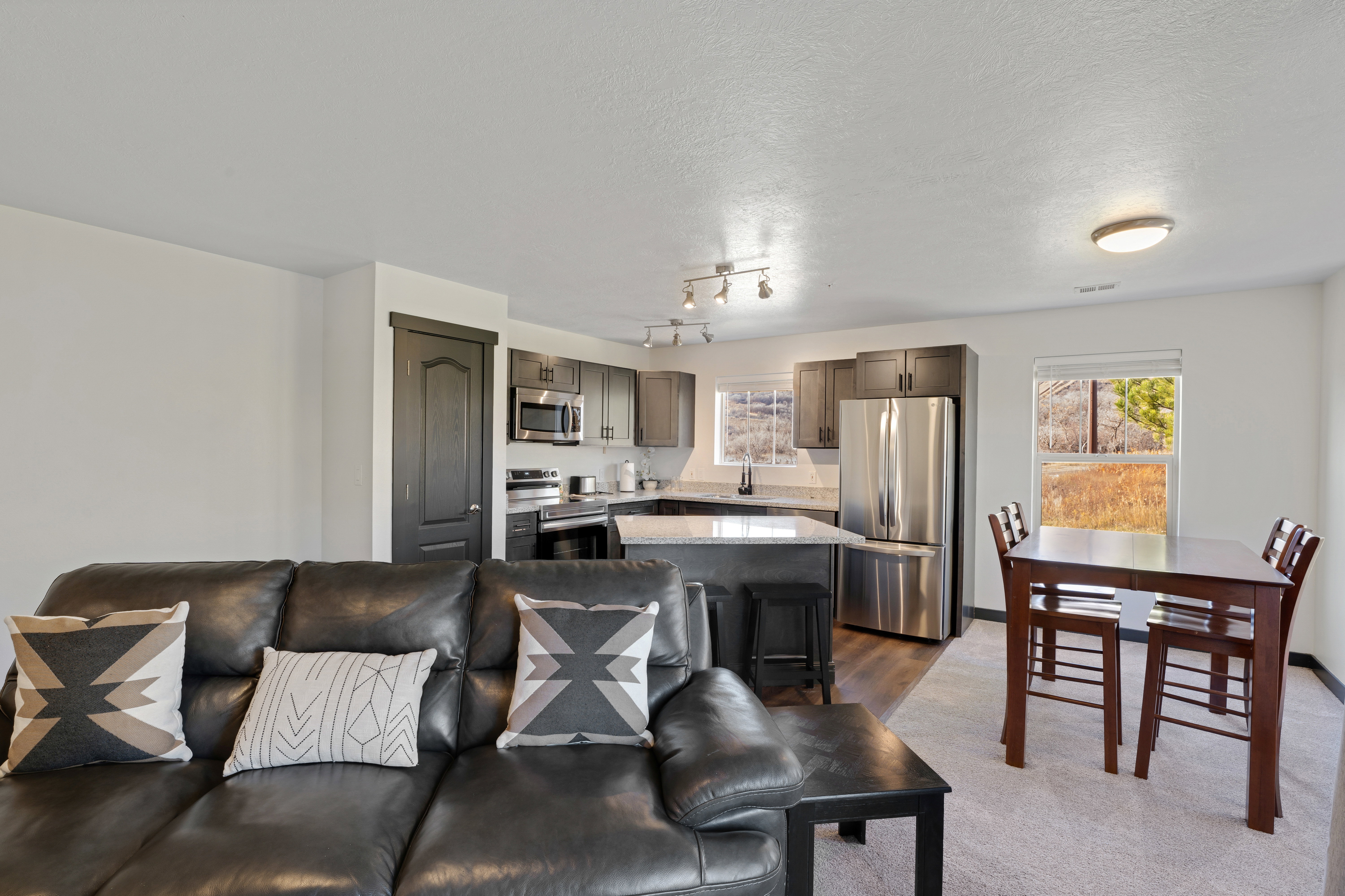 Living area featuring plenty of natural light and a textured ceiling