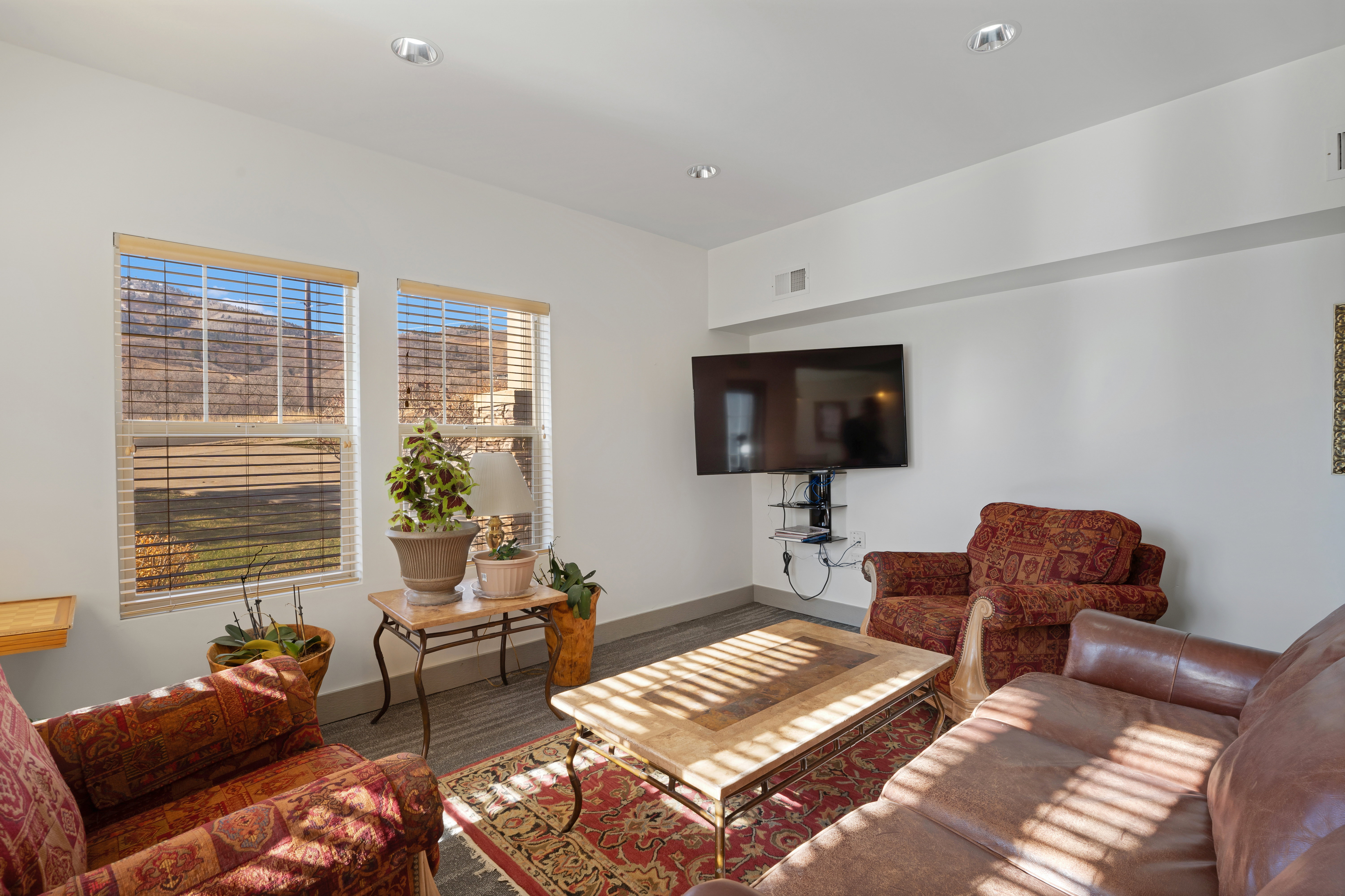 Living room featuring wood finished floors and recessed lighting