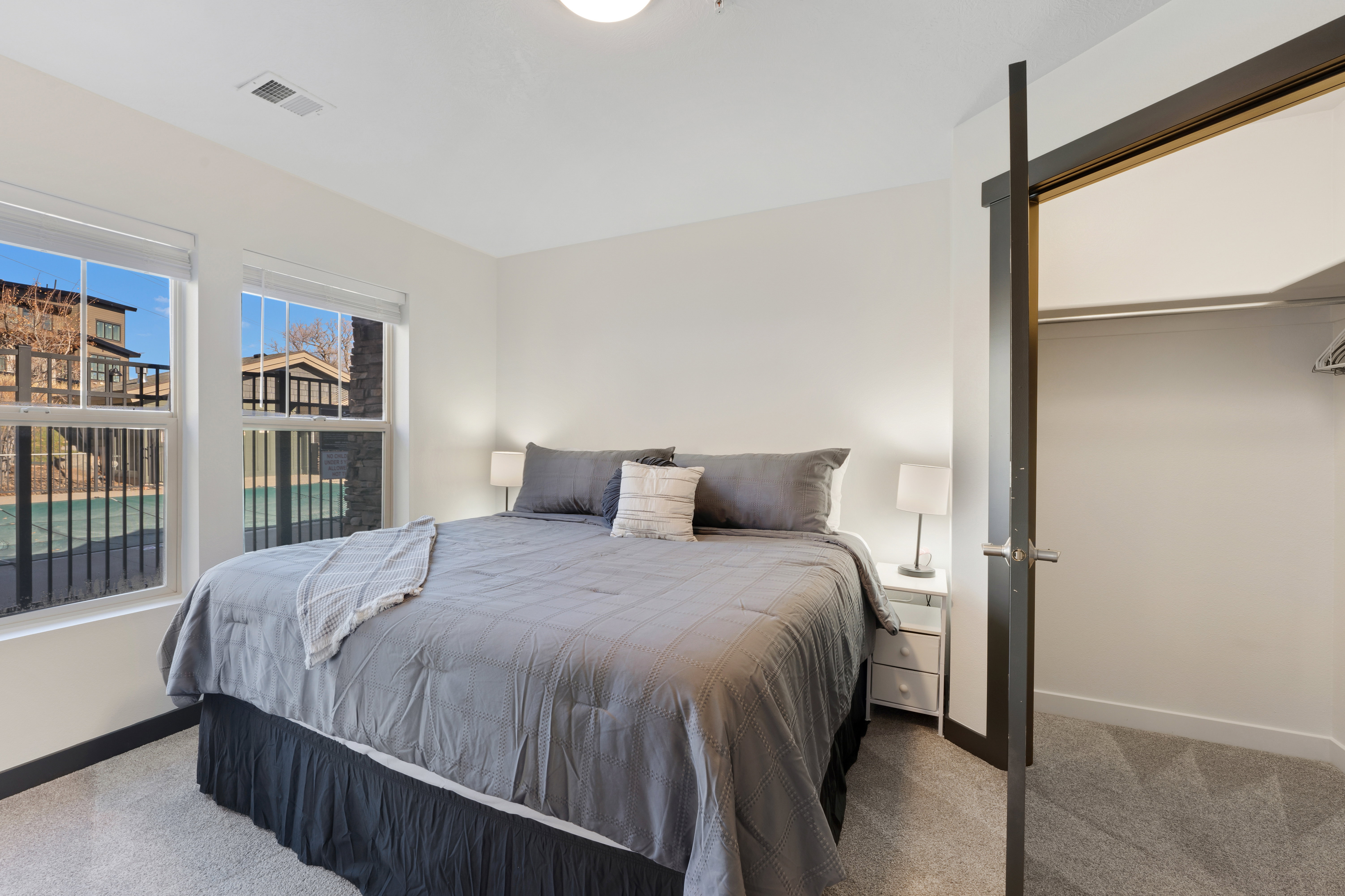 Carpeted bedroom featuring baseboards