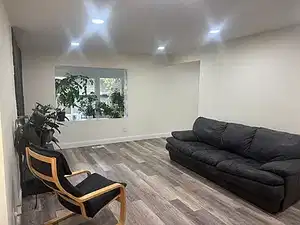 Living area featuring wood finished floors and recessed lighting