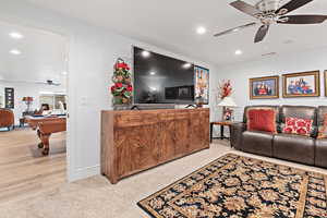 Living area featuring a ceiling fan, recessed lighting, billiards, and light colored carpet