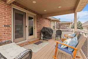 Deck featuring grilling area and outdoor lounge area