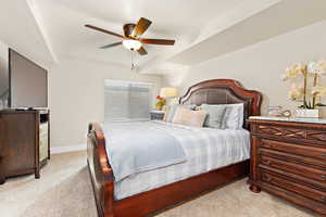 Bedroom featuring light colored carpet and ceiling fan