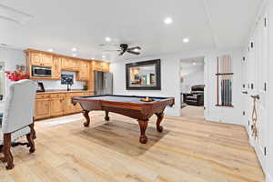 Game room featuring pool table, recessed lighting, light wood finished floors, and a ceiling fan