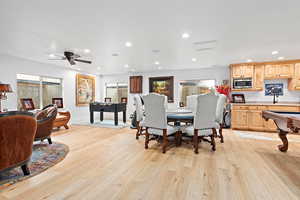 Dining room with light wood-style floors, recessed lighting, a ceiling fan, and pool table