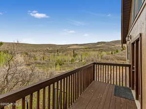Wooden terrace featuring a mountain view