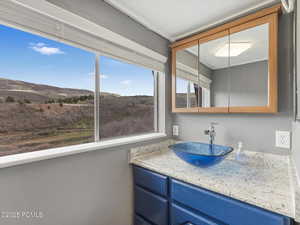 Bathroom with vanity and a mountain view