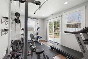 Workout room with a textured ceiling and recessed lighting