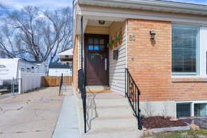 Property entrance with brick siding
