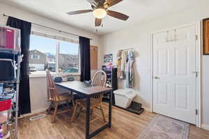 Dining area featuring light wood-style floors and ceiling fan