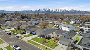 Aerial perspective of suburban area with a mountain backdrop