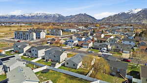 Aerial perspective of suburban area featuring a mountain backdrop