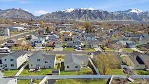 Aerial perspective of suburban area with a mountainous background