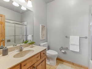 Bathroom featuring vanity and light tile patterned floors