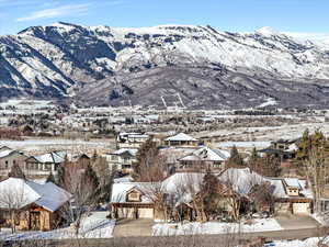 Mountain view featuring nearby suburban area