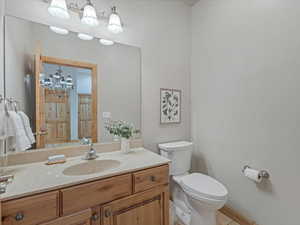 Bathroom with vanity and a chandelier