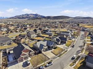Aerial view of residential area featuring a mountainous background