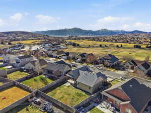 Aerial view of residential area with a mountainous background