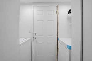 Laundry area featuring separate washer and dryer