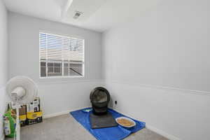 Playroom with carpet floors and a textured ceiling