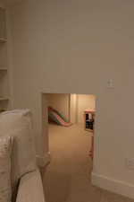 Interior space featuring light carpet and baseboards